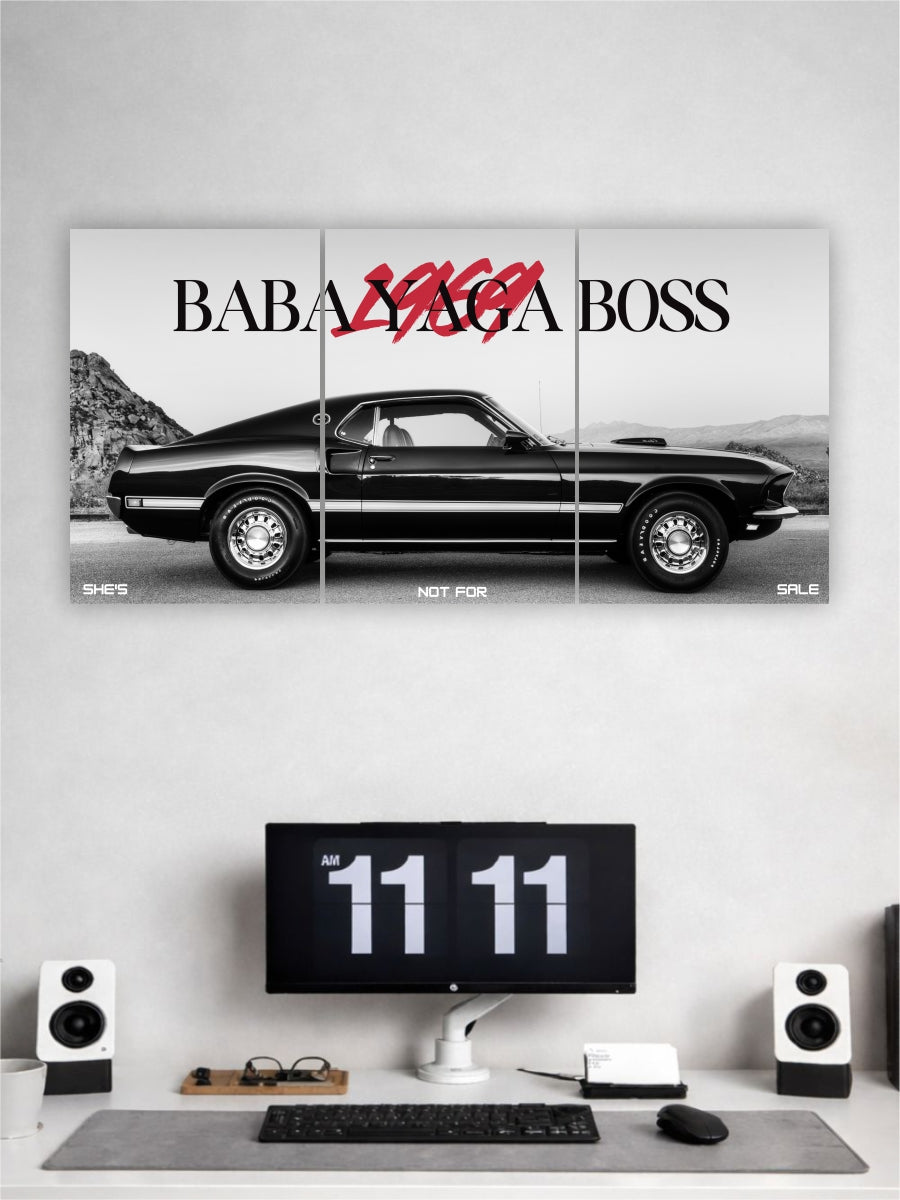 Triptych wall art of a black car with 'Baba Yaga Boss' text above a desk setup.