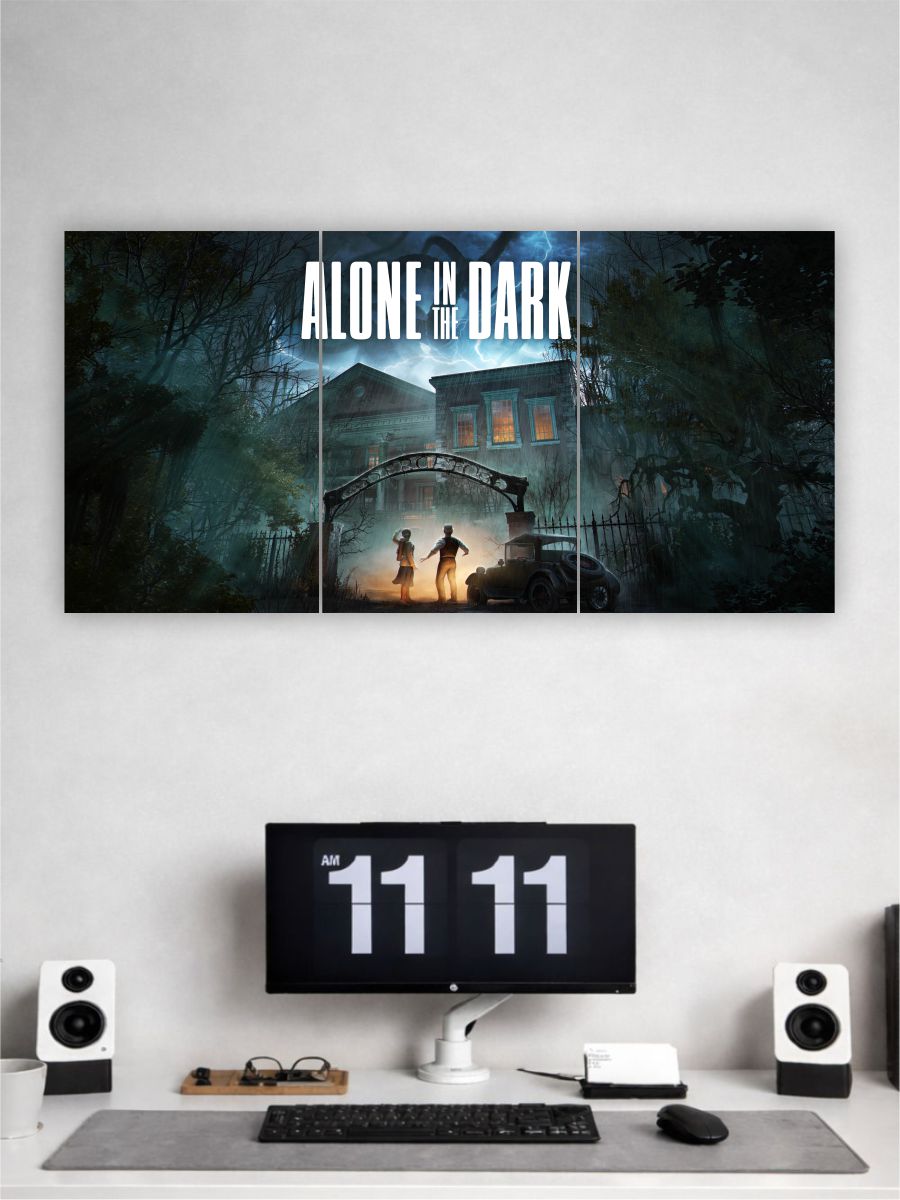 Wall art with 'Alone in the Dark' design above a computer setup on a white wall.