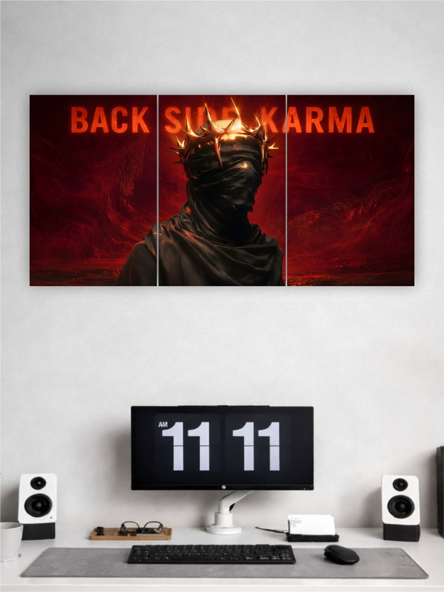 Wall art with a masked figure and 'Back Side Karma' text above a computer setup.