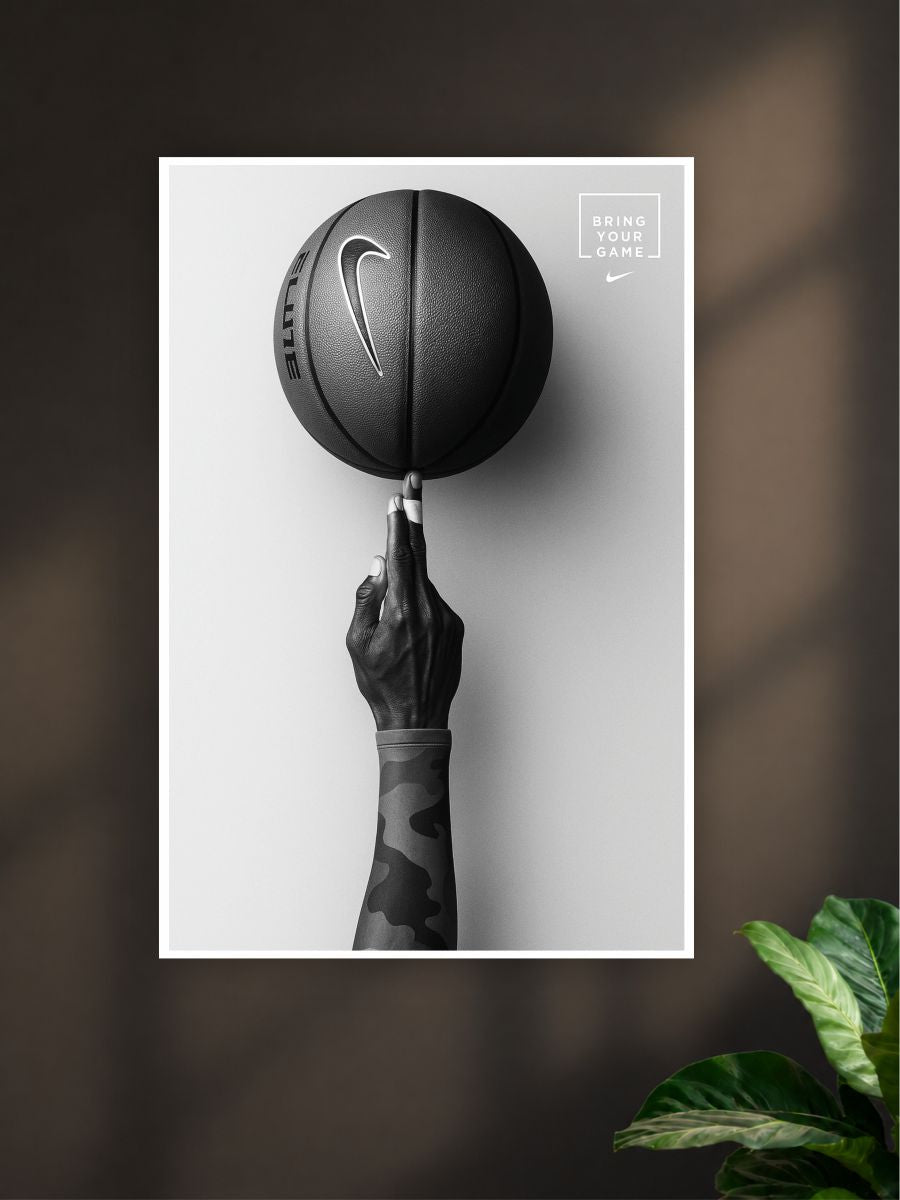 Black and white poster of a hand holding a Nike basketball against a dark background