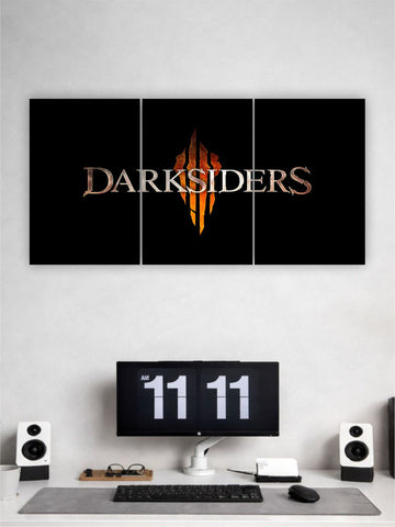 Darksiders logo on a wall above a computer setup with a digital clock.
