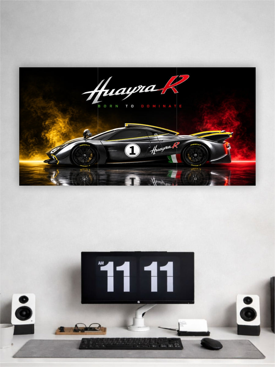 Ferrari Huayra R car poster on a wall above a desk with a computer setup.