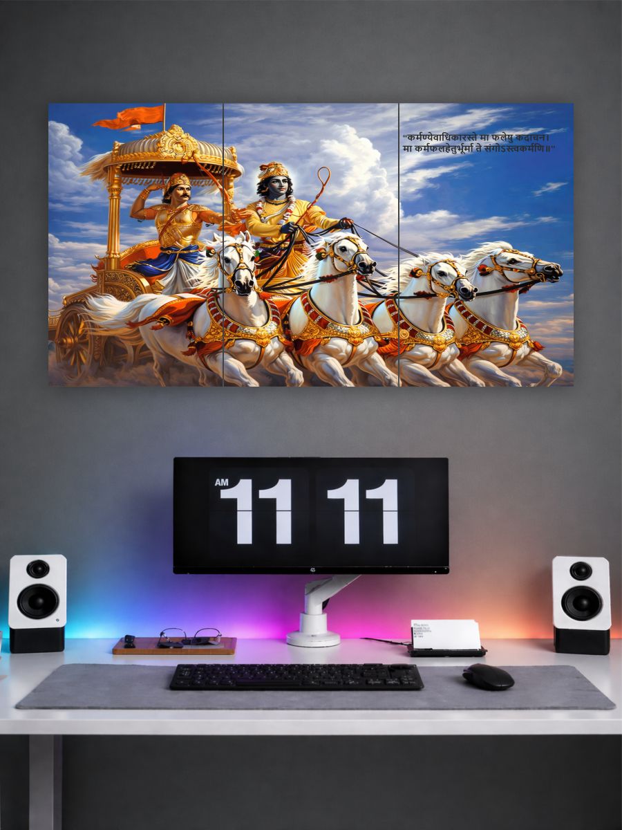 Decorative wall art of a神灵 in a chariot with horses on a gray wall above a desk with a computer setup.