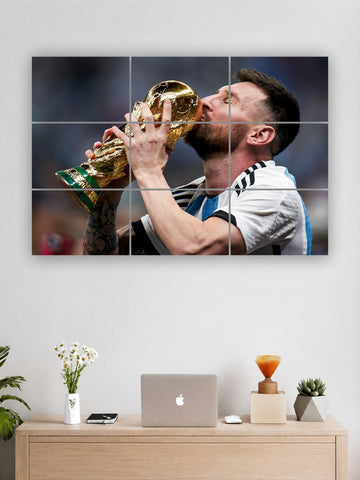 Large wall art of a soccer player kissing a trophy in a modern office setting.