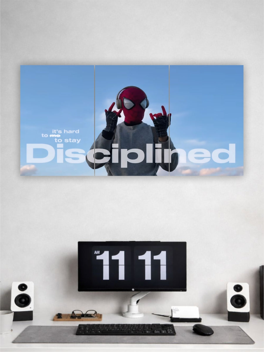 Person wearing a Spider-Man mask on a computer screen with motivational text, in front of a computer setup.